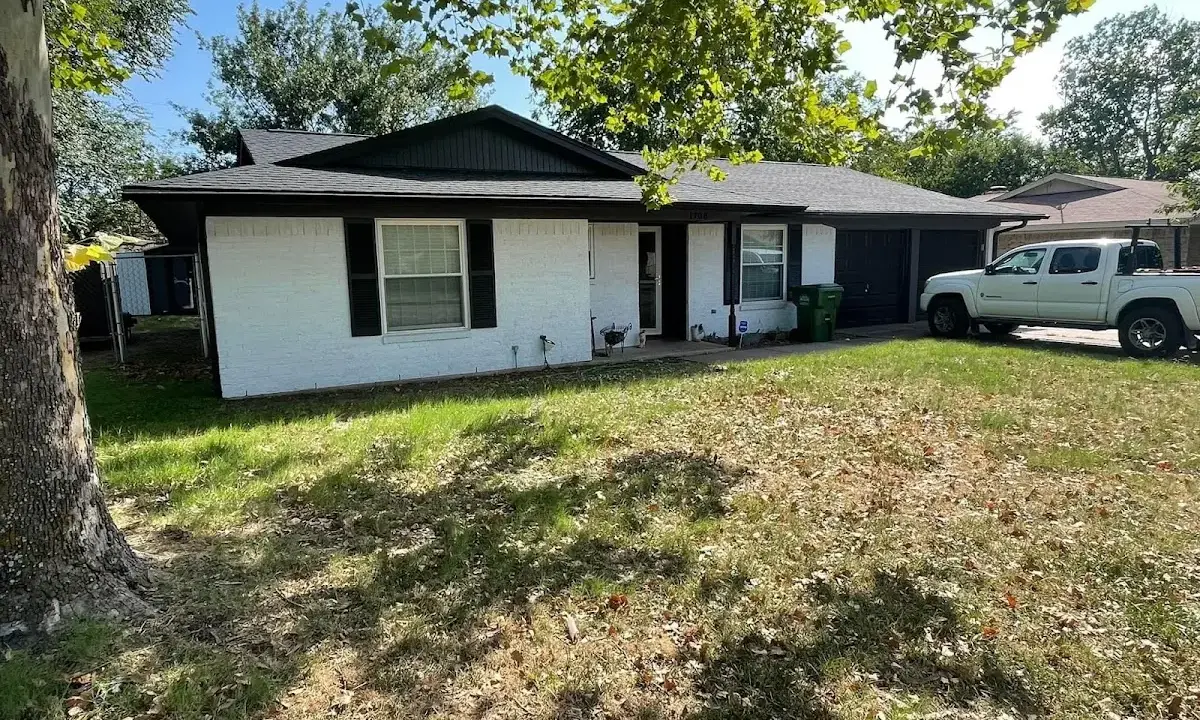Professional roofing crew working on a residential roof in Wahoo